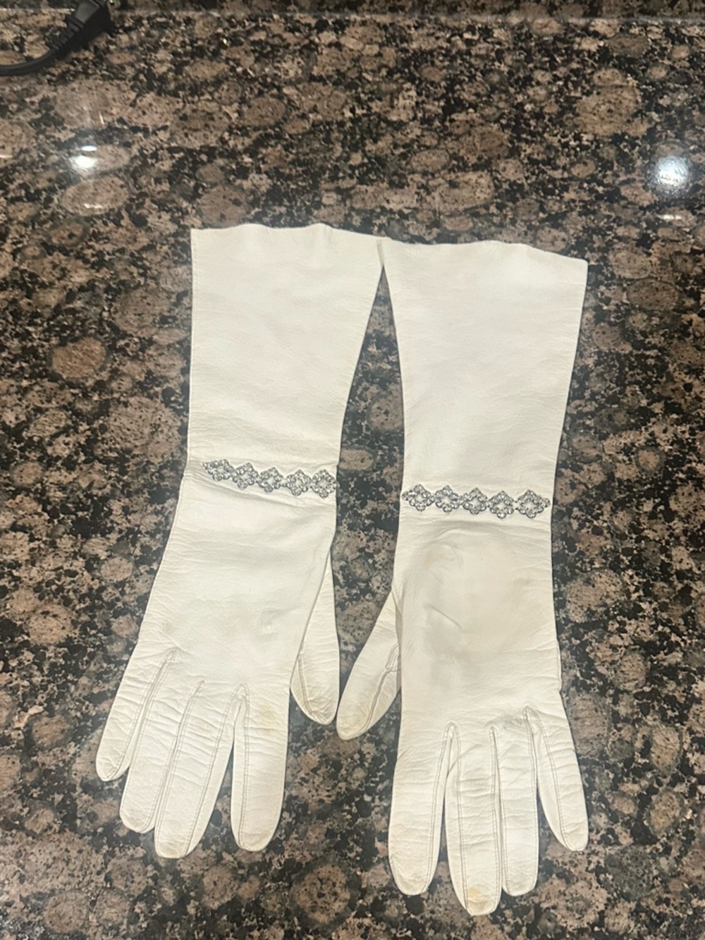 Vintage White long Gloves with decorative rhinestone accents at the wrist.